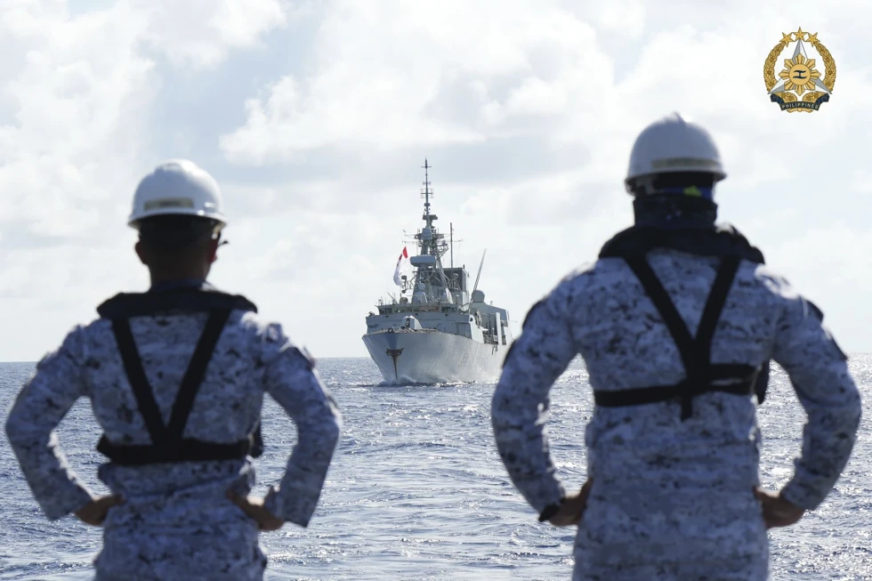 In this handout photo provided by Public Affairs Office Armed Forces of the Philippines, Philippine Navy personnel watch the Canadian vessel HMCS Montreal (FFH336) during the Multilateral Maritime Cooperative Activity being held in the West Philippine Sea, on Wednesday, Aug. 7, 2024. (Private First Class Carmelotes/Public Affairs Office Armed Forces of the Philippines via AP, File)